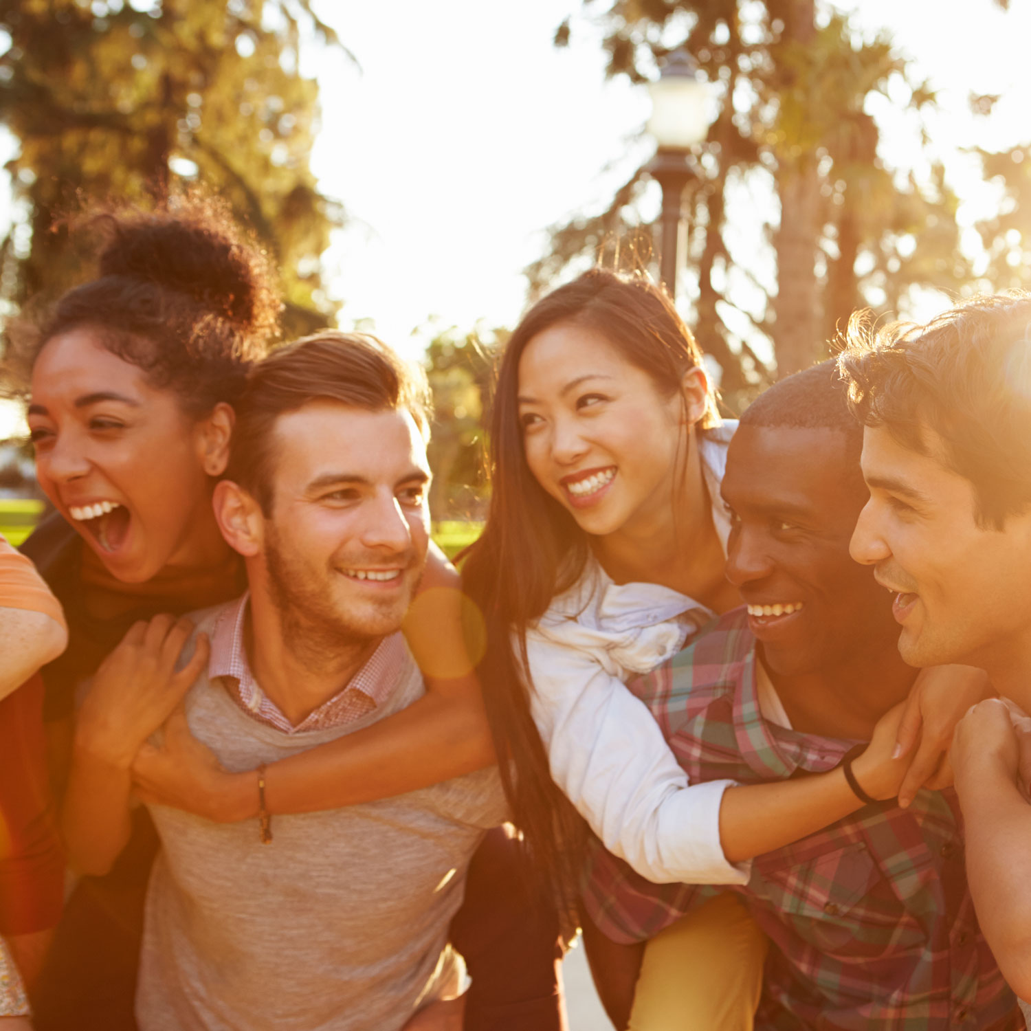 A group of friends hanging out during a sunset